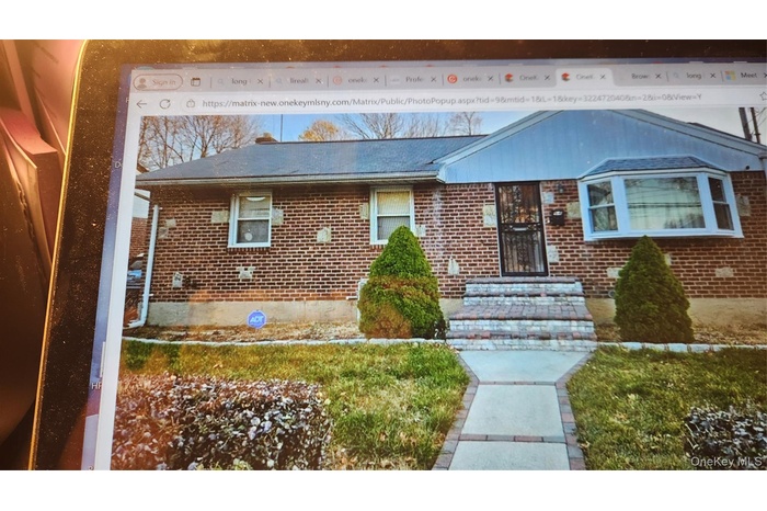 View of front of house with brick siding