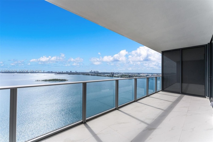 Breathtaking panoramic sunrise views of Biscayne Bay and the Atlantic Ocean from the expansive private terrace of Aria Reserve #2504 in Edgewater, Mia