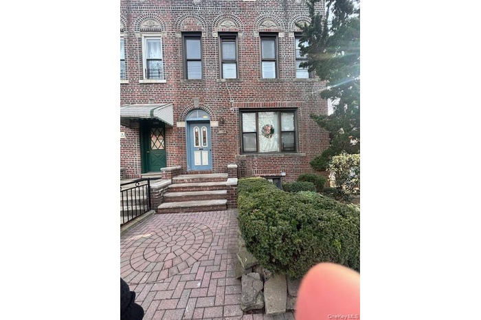 View of front of house featuring brick siding