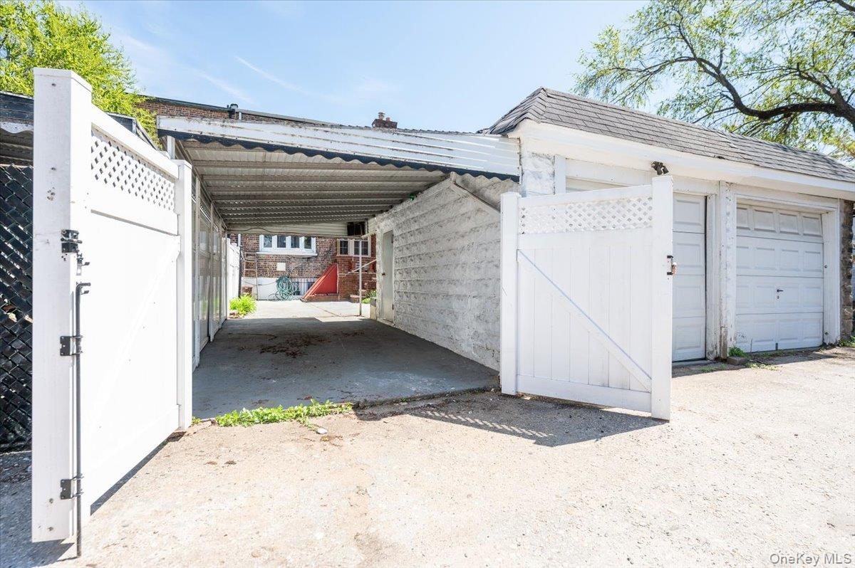 Gated Rear Entrance to Carport