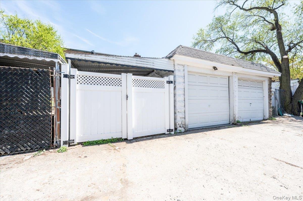 Gated Rear Entrance to Carport