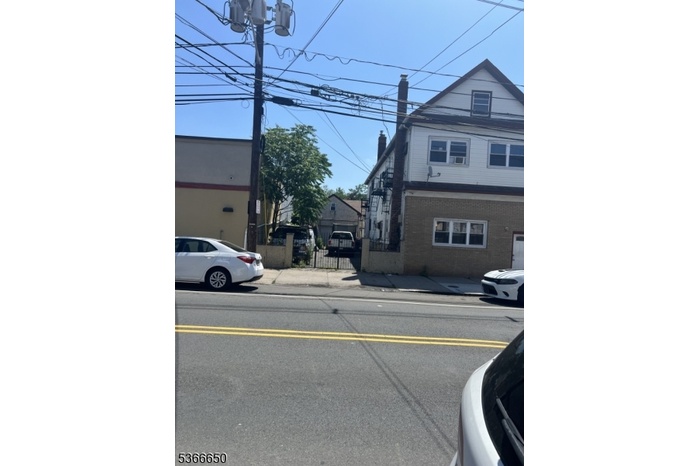 Left side w/ 2 car garage