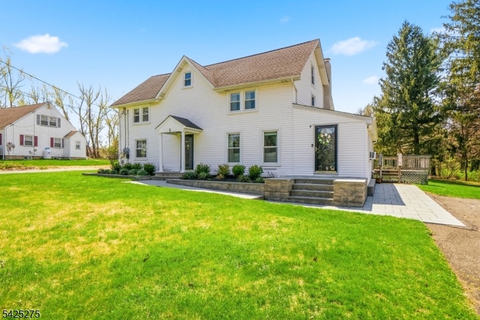 Home exterior w/ paver walkway
