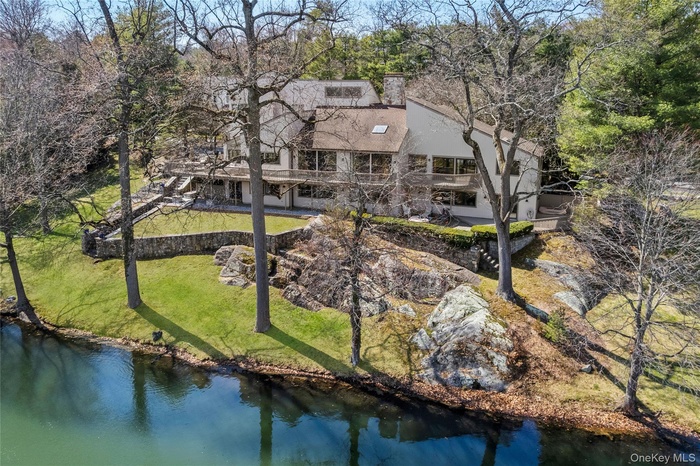 Gorgeous Rear Elevation showing entire house overlooking the pond.  Ho