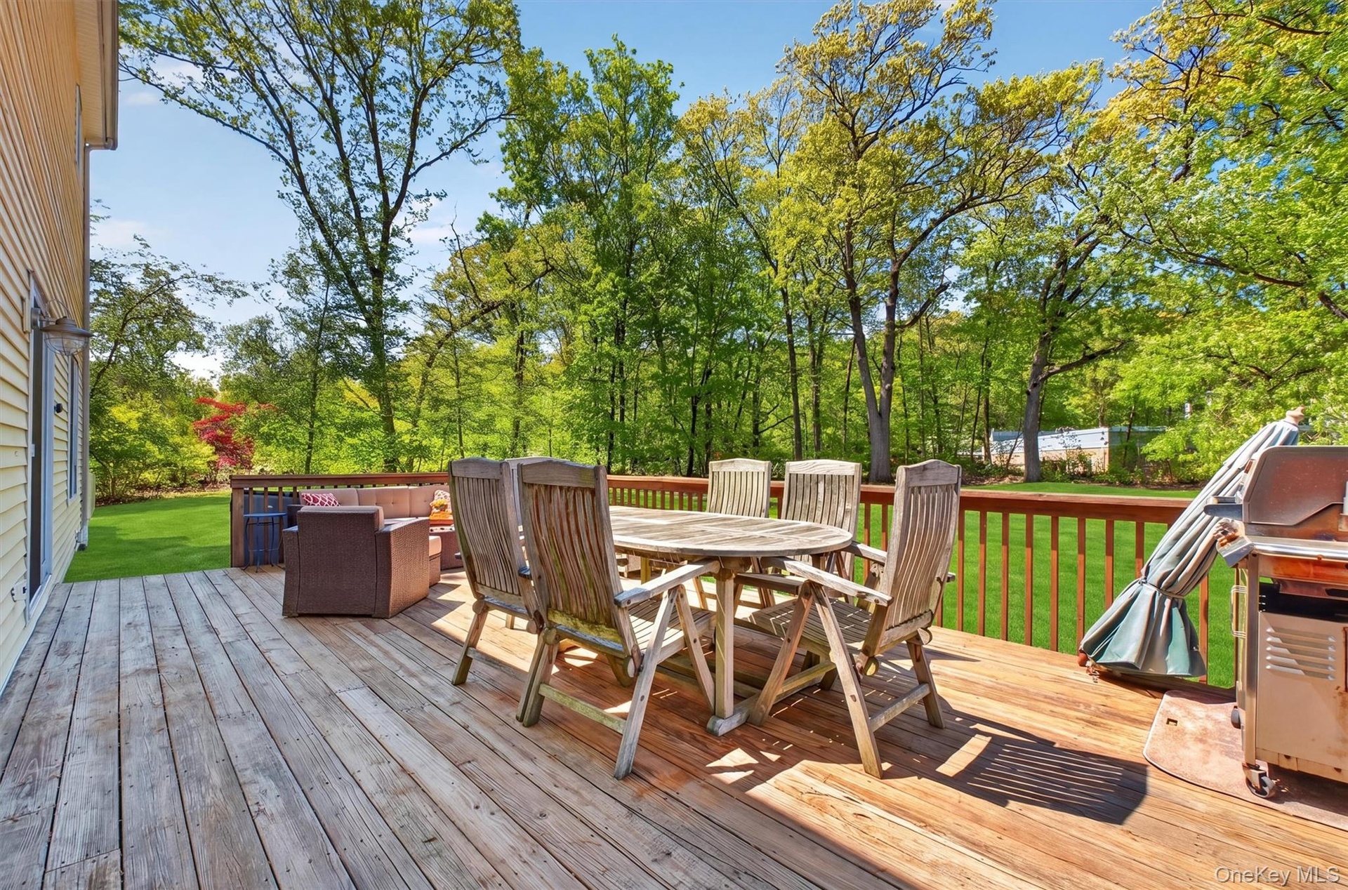 The large deck leads out to the amazing yard.