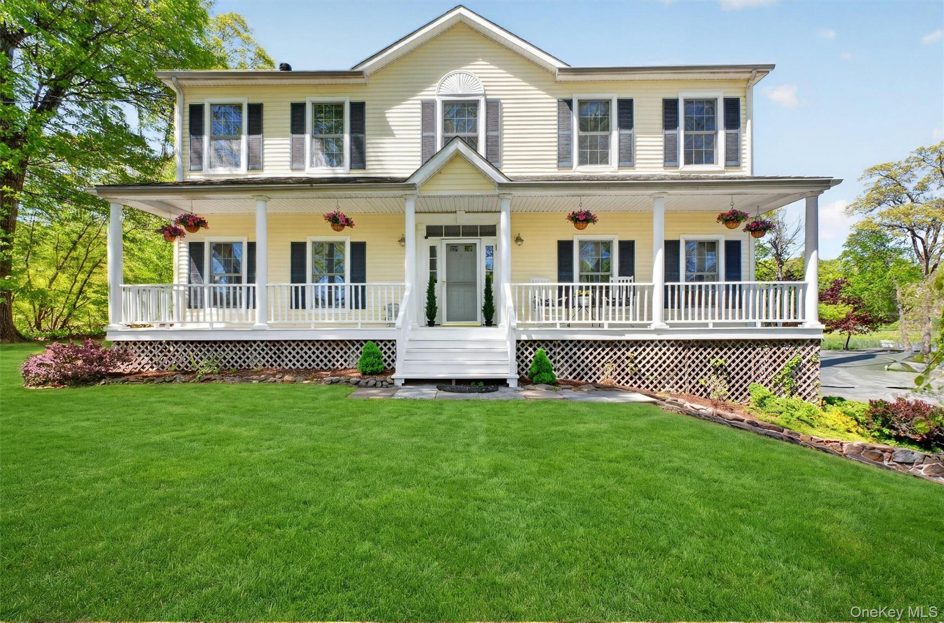 The full length front porch is the perfect spot to relax and unwind after a long day.