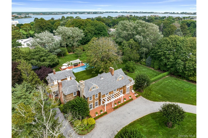 Gated two acre estate with Tennis, pool and putting green.