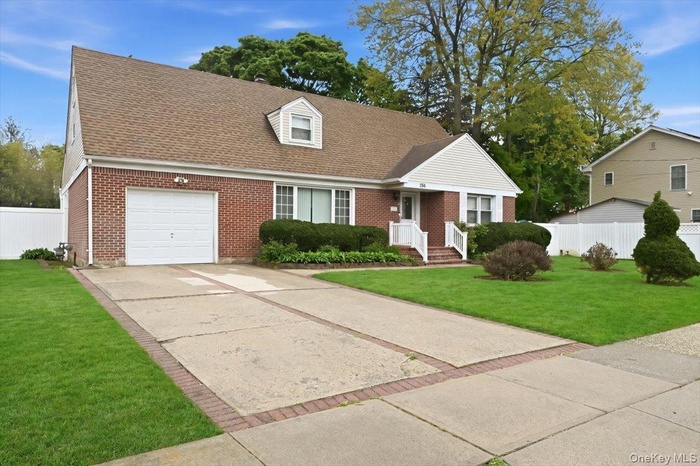 Brick exterior featuring a single-car garage.