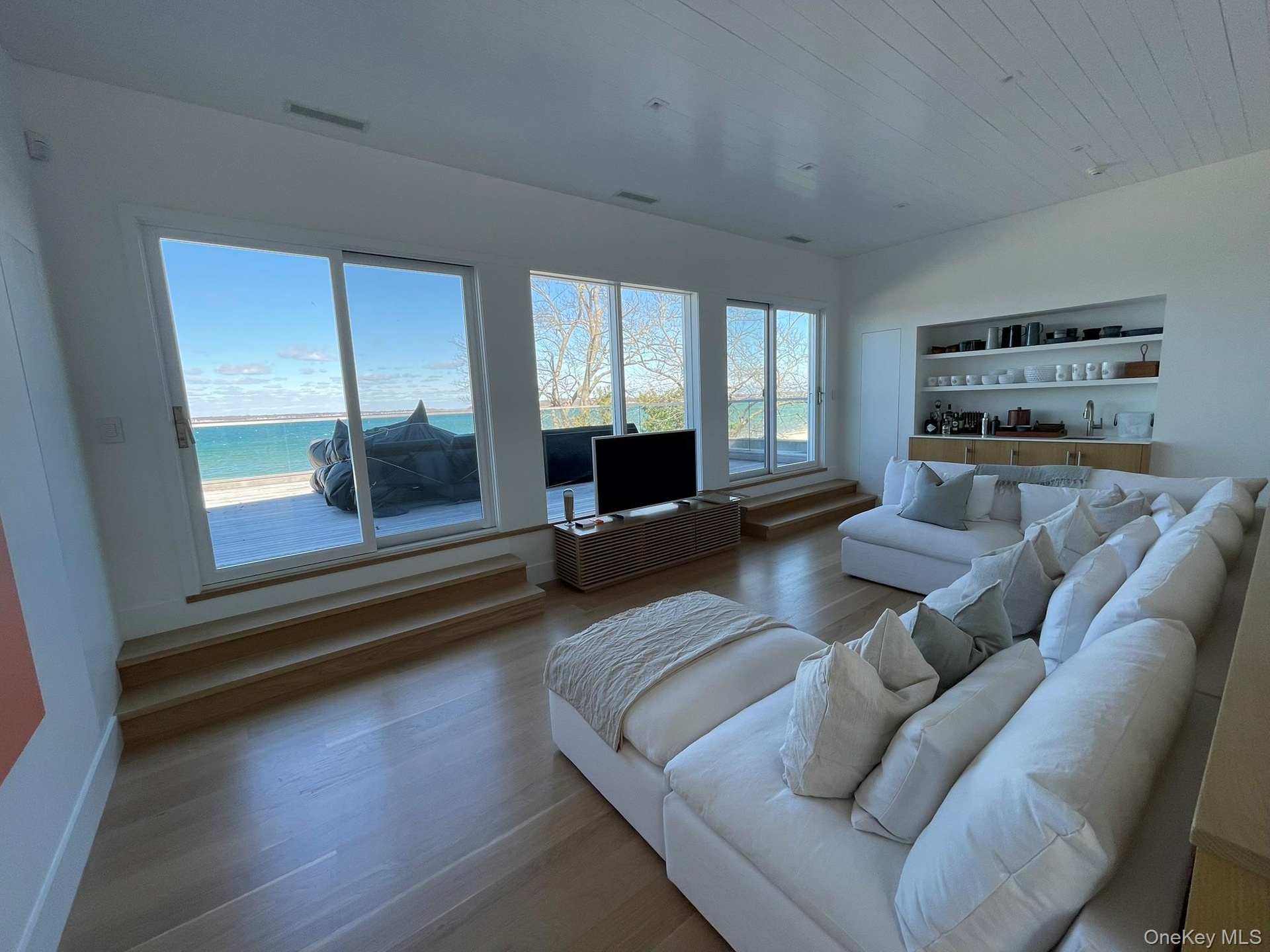 Living room with wood finished floors and visible vents