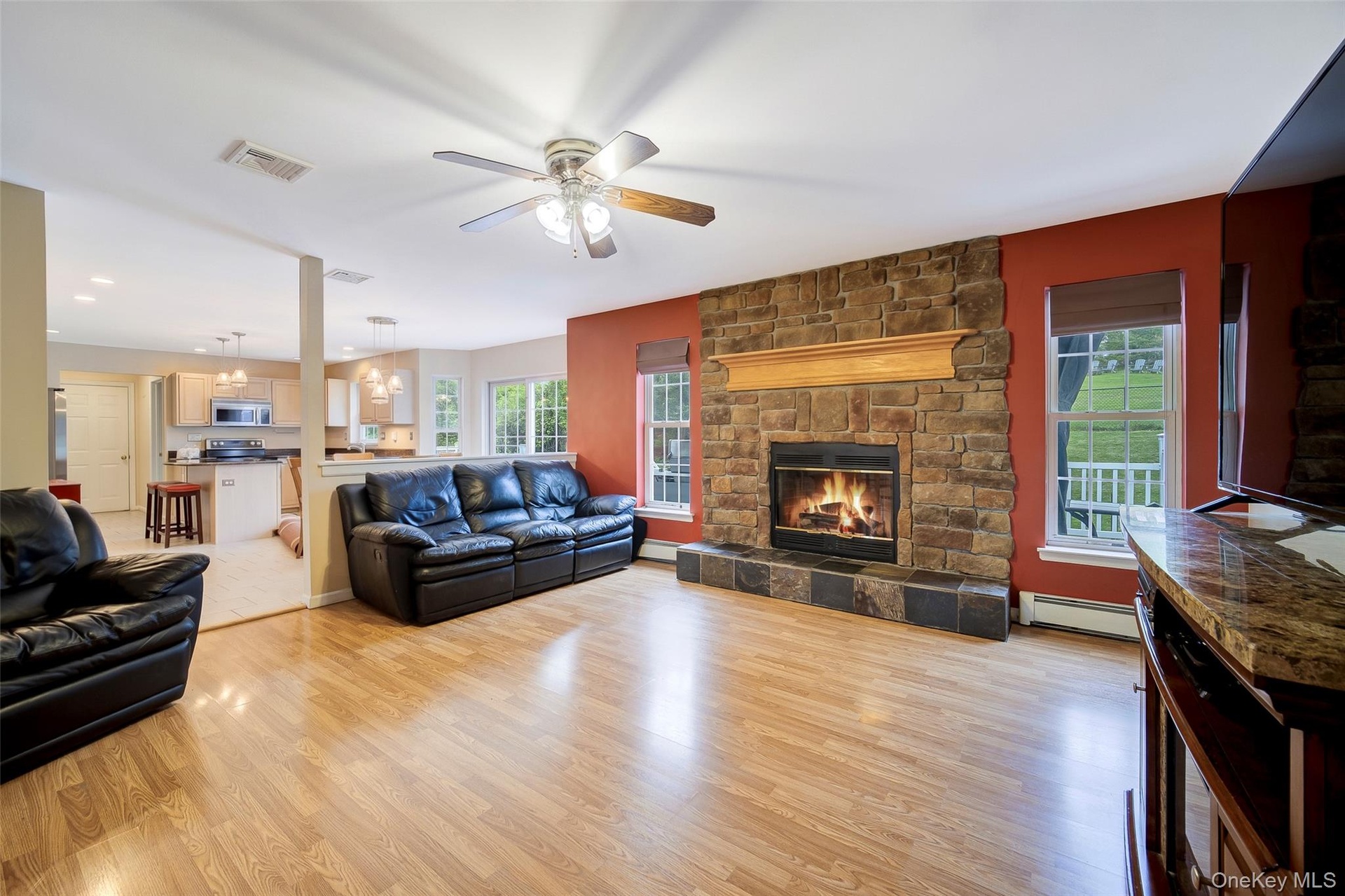 Wood fireplace with masterful stone mantle and setting