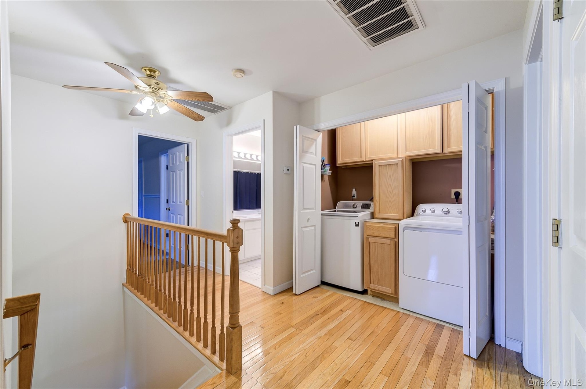 2nd level laundry with cabinetry