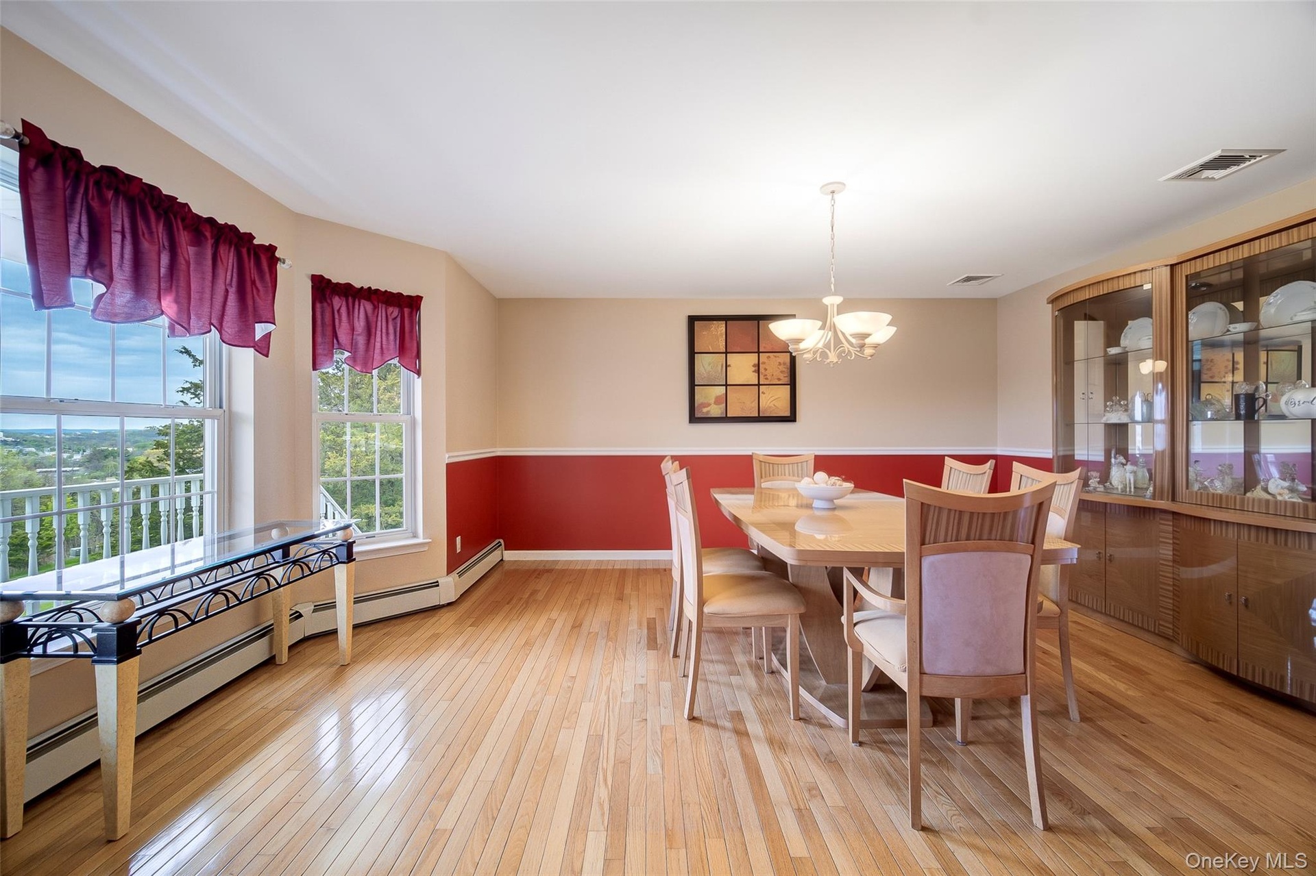 Oversized bay windows in spacious dining room