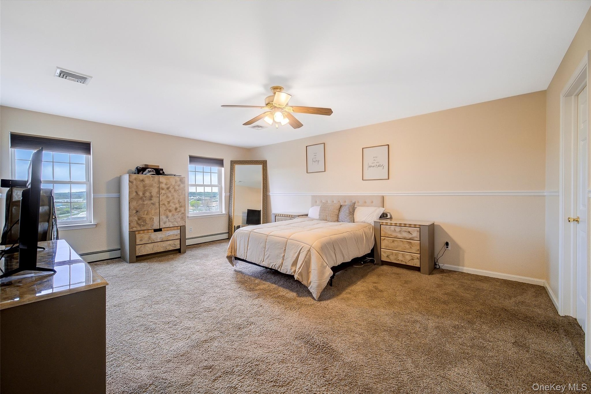Main bedroom with walk-in closet and ensuite.