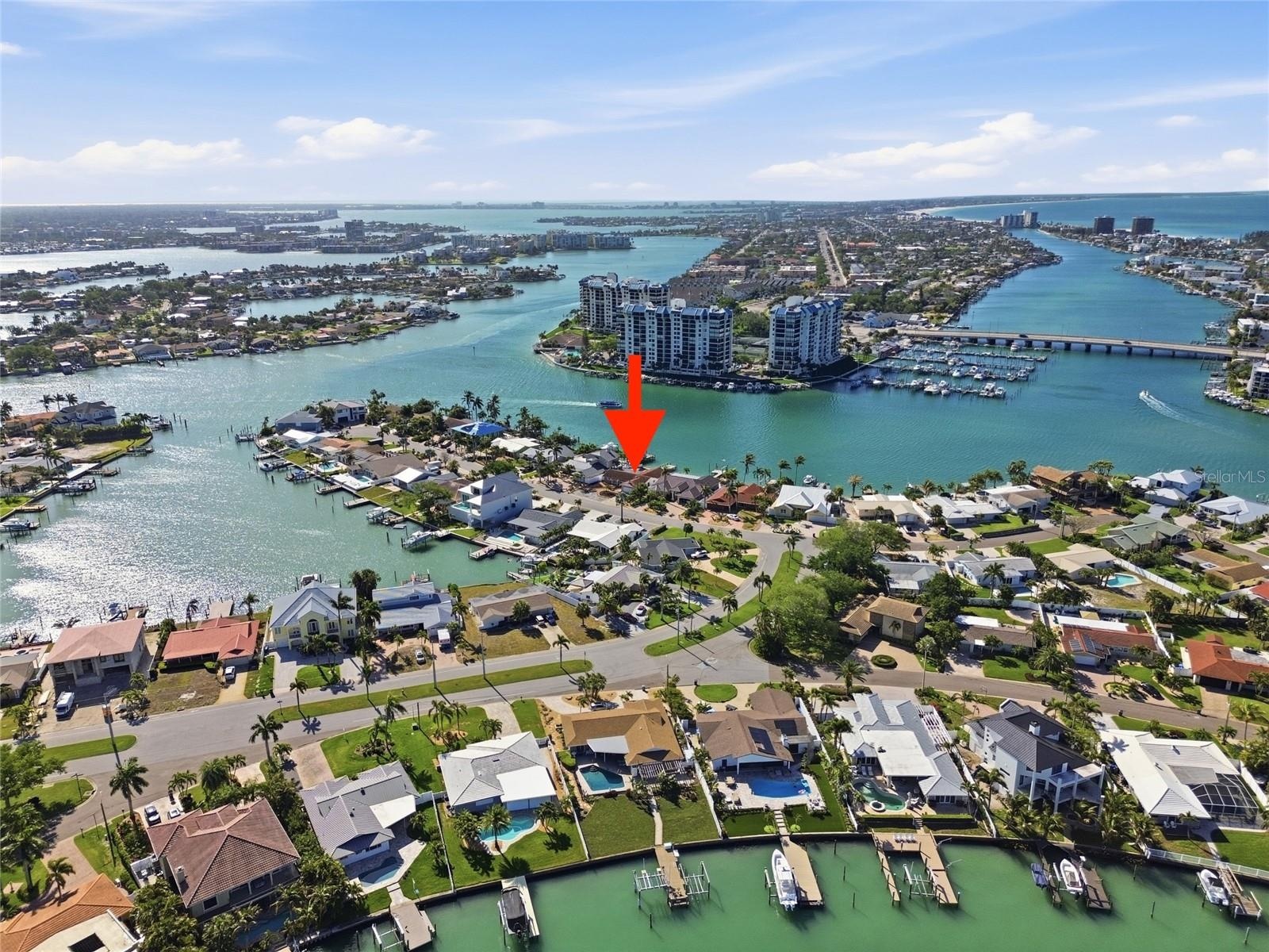 Drone photo of the broader Paradise Island neighborhood showing the Intracostal and the Gulf of Mexico to the right ("red arrow" indicates 4 Bellevue)