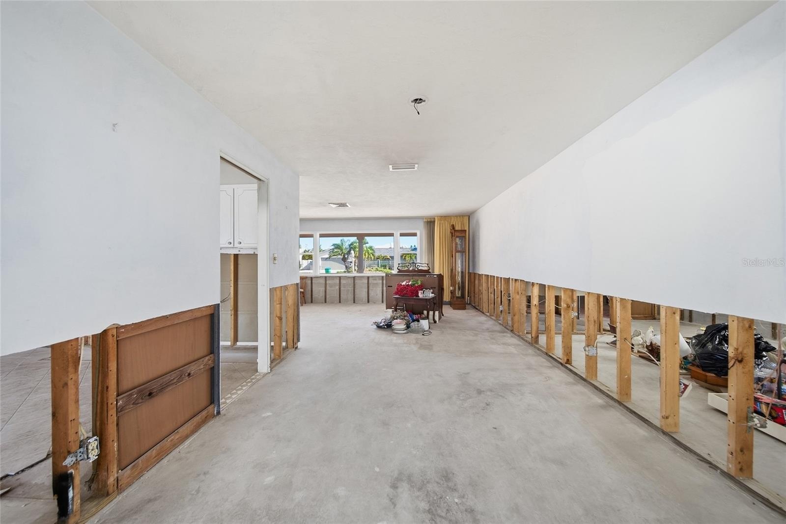 Extension of living room leading back to the family room.