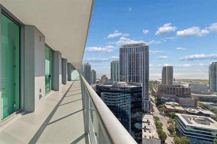 60 ft balcony runs the full length of condo with views of both city and bay