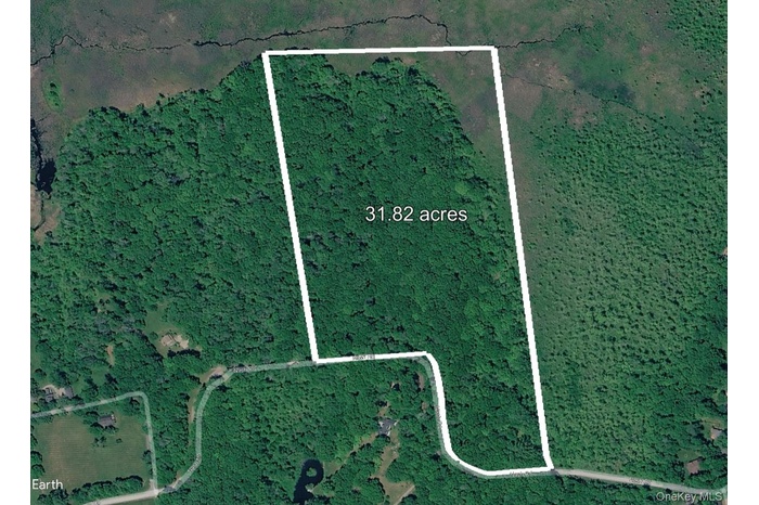 Discover serene privacy on this 31.82-acre wooded parcel along Nash Road in North Salem, New York.