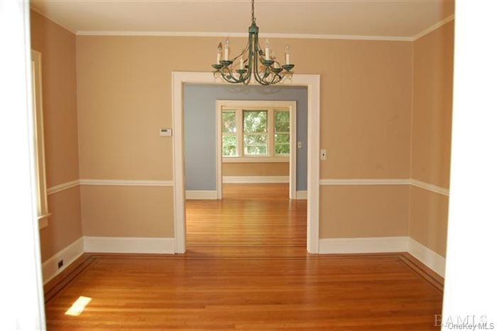 Formal Dining Room with Beautiful Crown Molding and Hardwood Floors