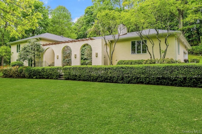 Walk from the Driveway to the Front Door, along the Pergola.