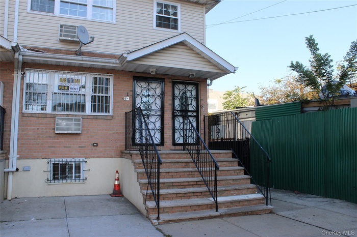 Entrance to property featuring brick siding
