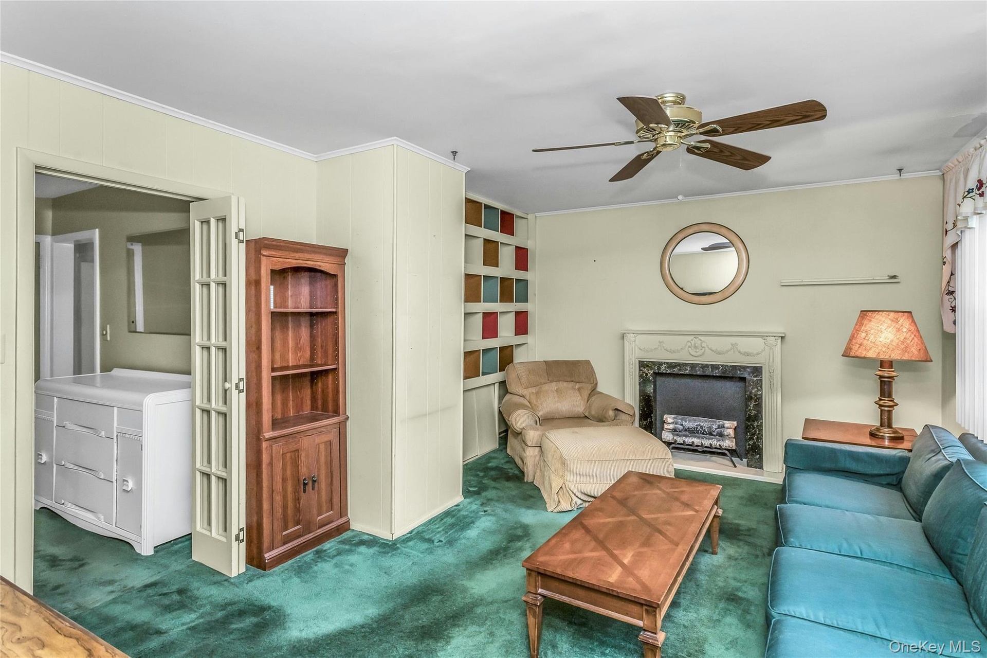 Spacious Family Room with faux fireplace and a beautiful view with access to the oversized backyard