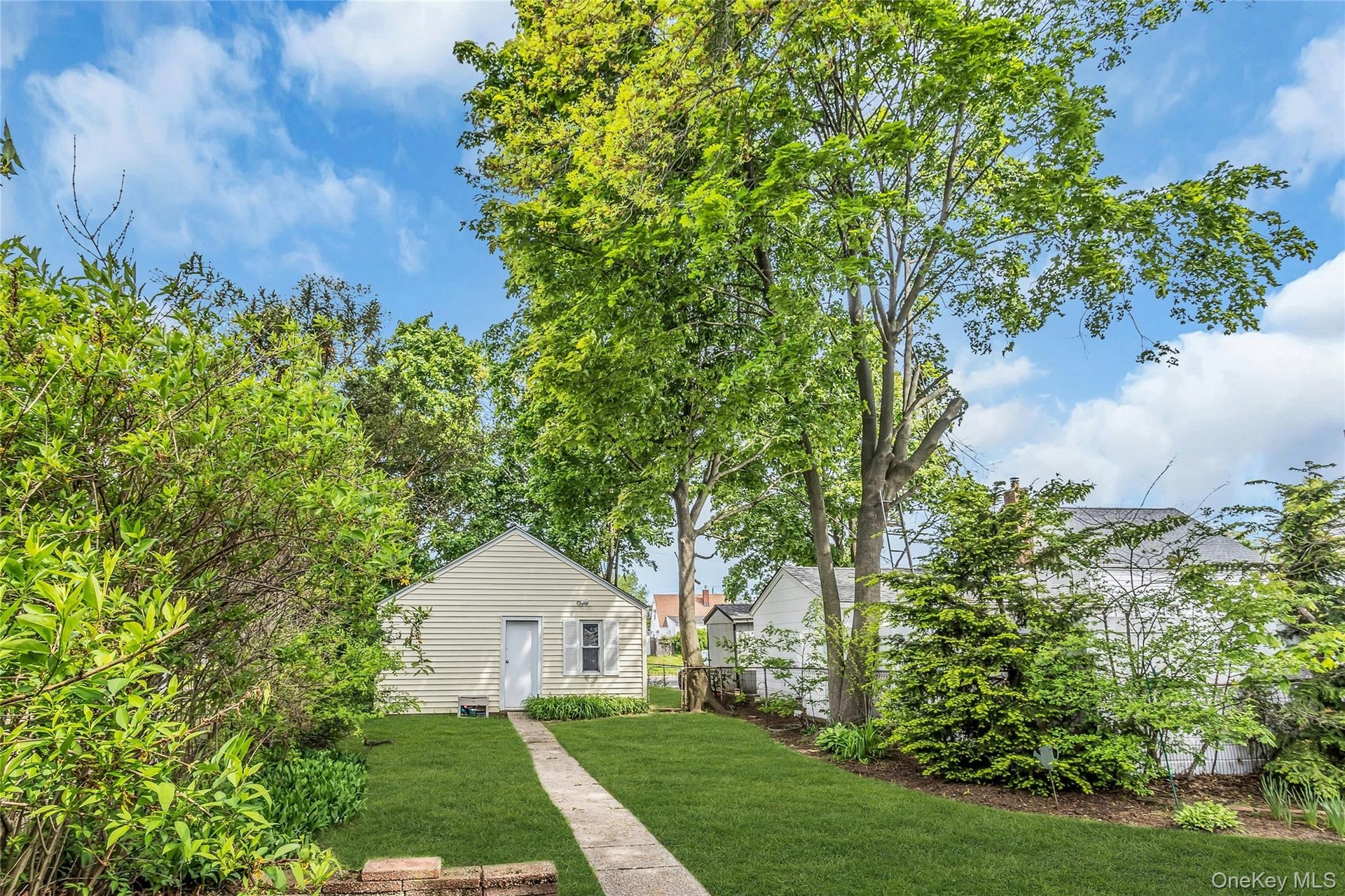 Tremendous, oversized property with detached garage and additional driveway behind lot