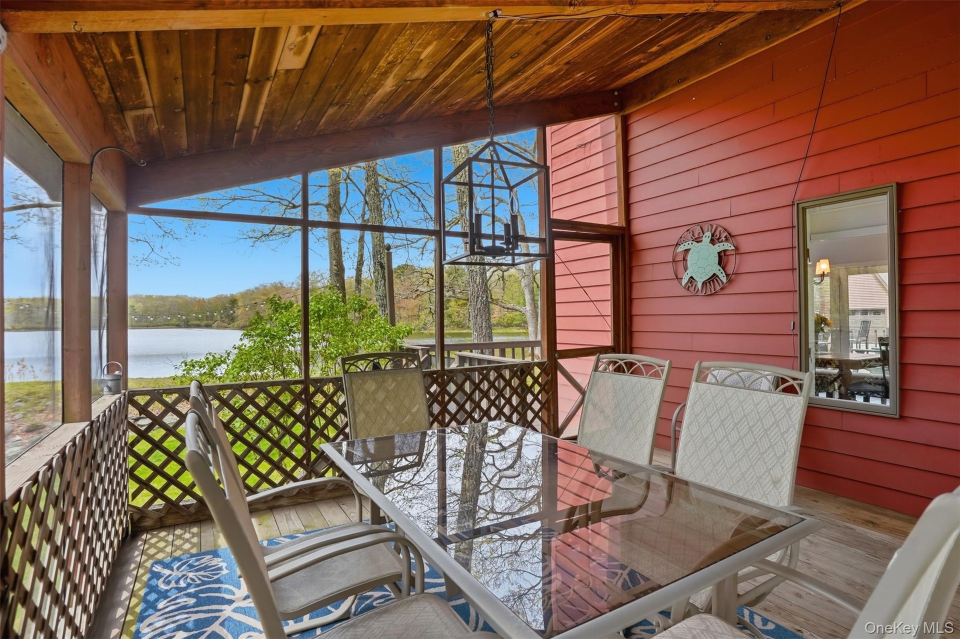 Screened in porch with a view - access from kitchen or deck overlooking lake