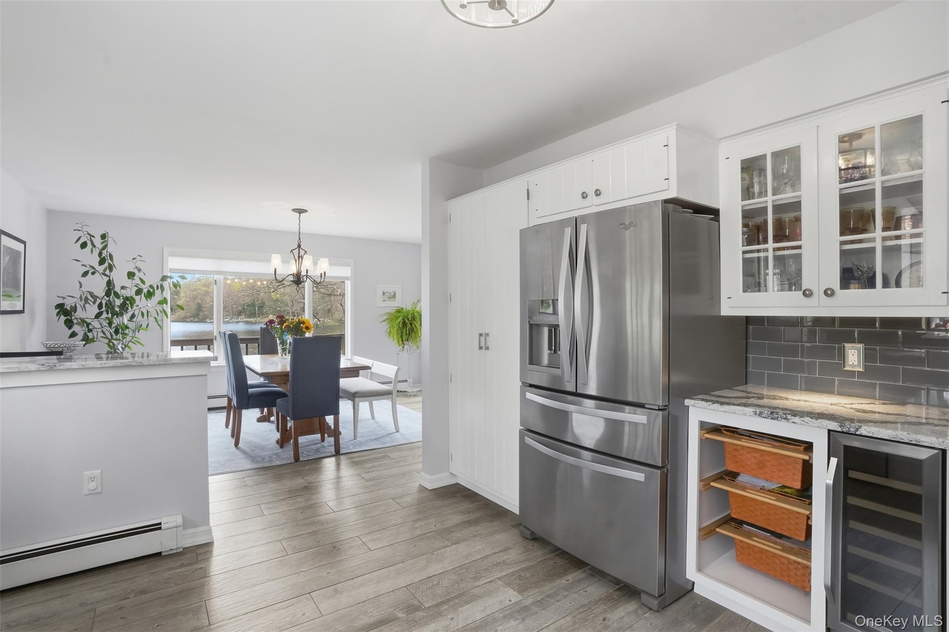 Doble door GE refrigerator, under counter storage baskets, wine cooler.