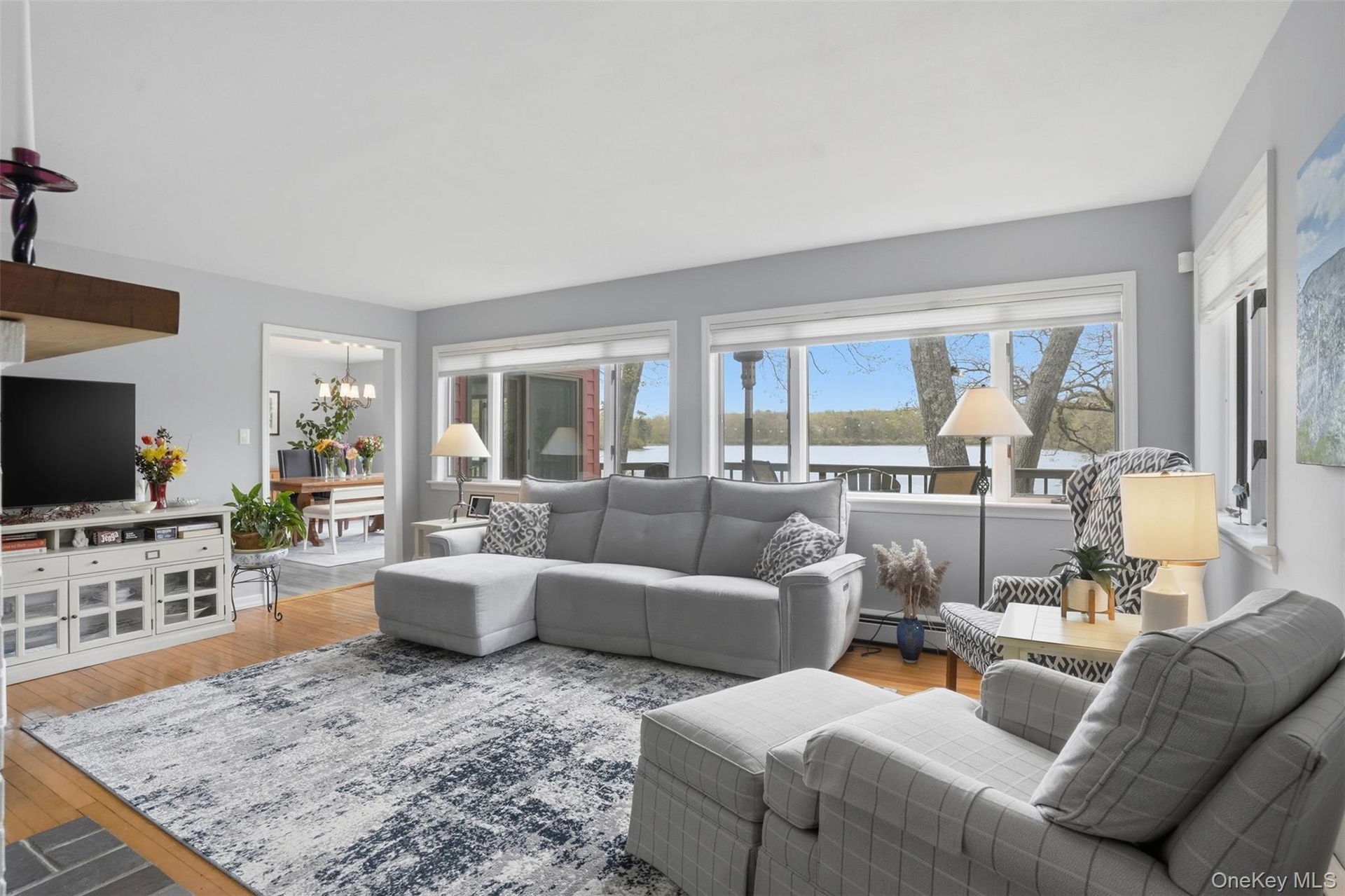 Living rooms flows into dining room.