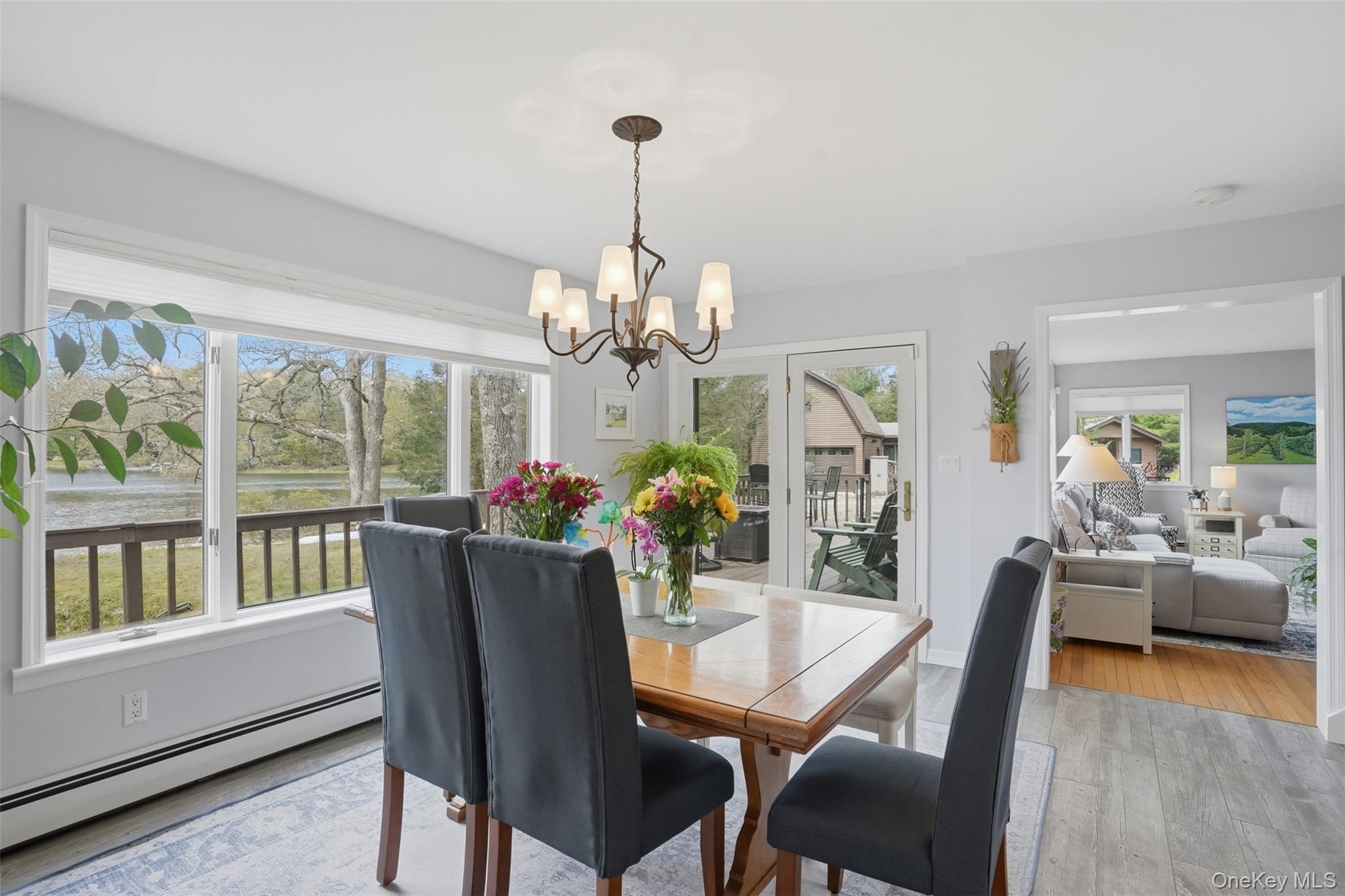 Beautiful windows overlooking pond. Exit/entry to deck. Entertain with ease inside and out!