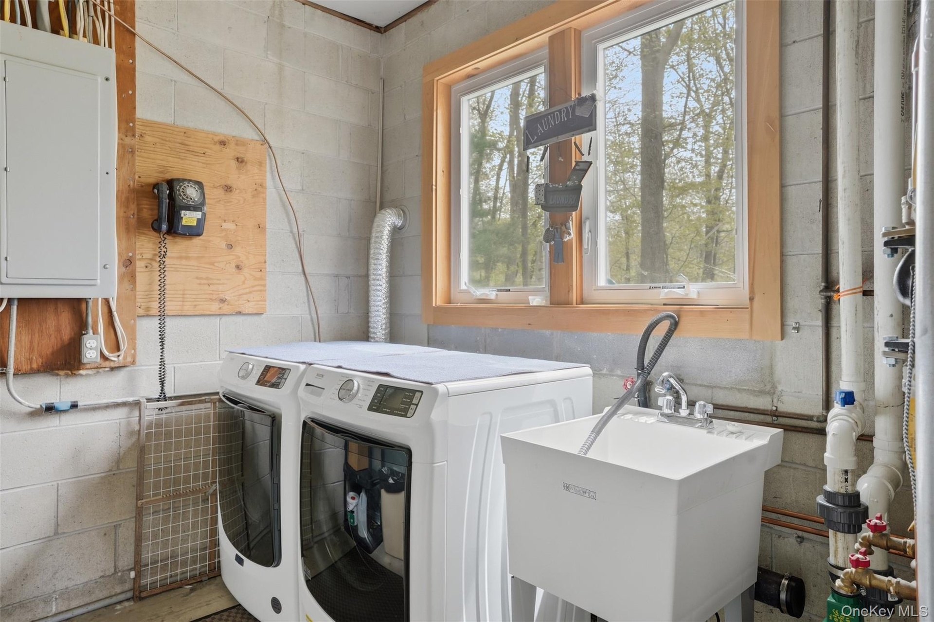 Lower Level. Washer/Dryer slop sink. Utility room.