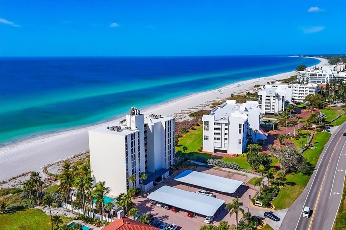Direct beachfront setting on Longboat Key with panoramic Gulf views