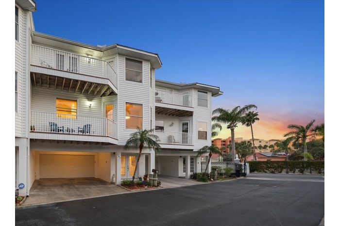 Experience captivating golden sunsets year-round from the comfort of this North Redington Beach residence.