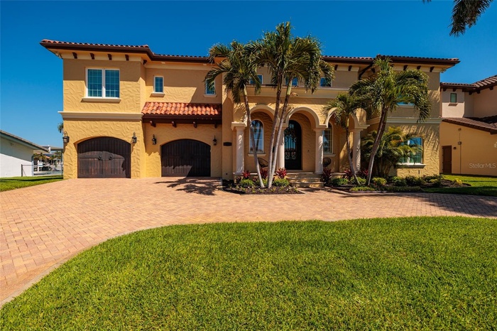 Palm Beach Style in St. Pete! Your 5 Bedroom/ 5.5 Baths/ tandem 4 Car Garage/ 4757 heated square foot home on a 90x111 Lot!