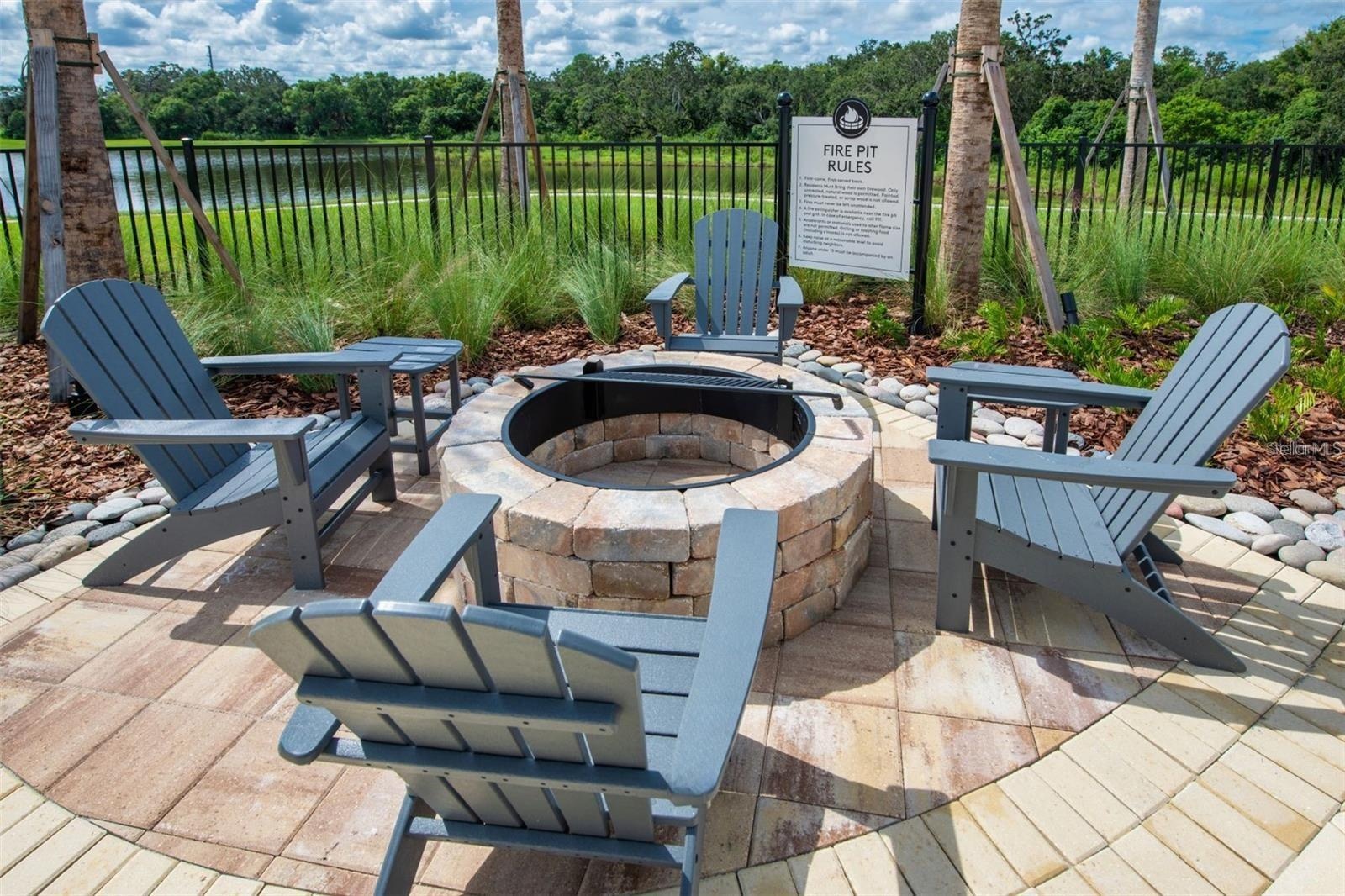 Outdoor gathering area with fire pit seating for relaxed evenings with neighbors.
