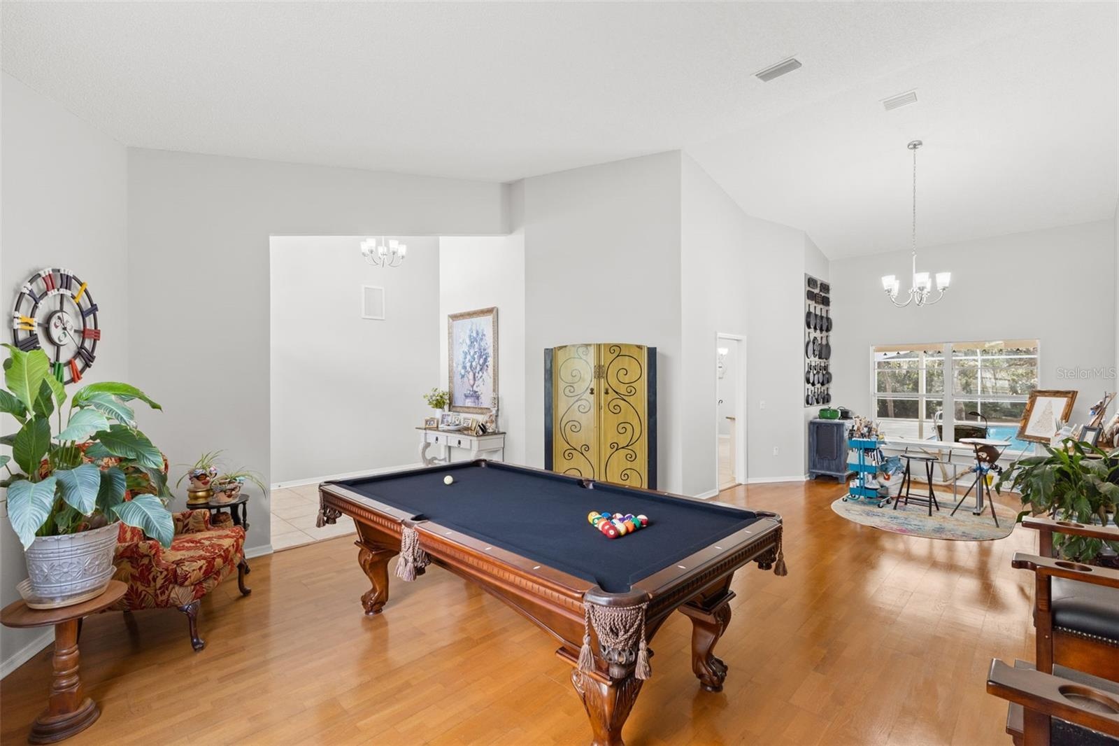 Bonus area could be used as formal living or dining.  Current owners uses it as a pool room and art studio.