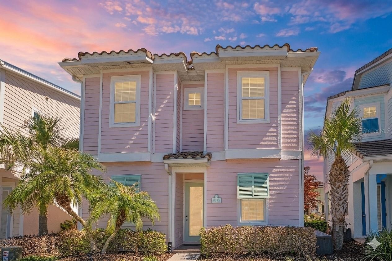 Coastal inspired Margaritaville cottage in Kissimmee Florida near Disney with vibrant exterior and prime resort location