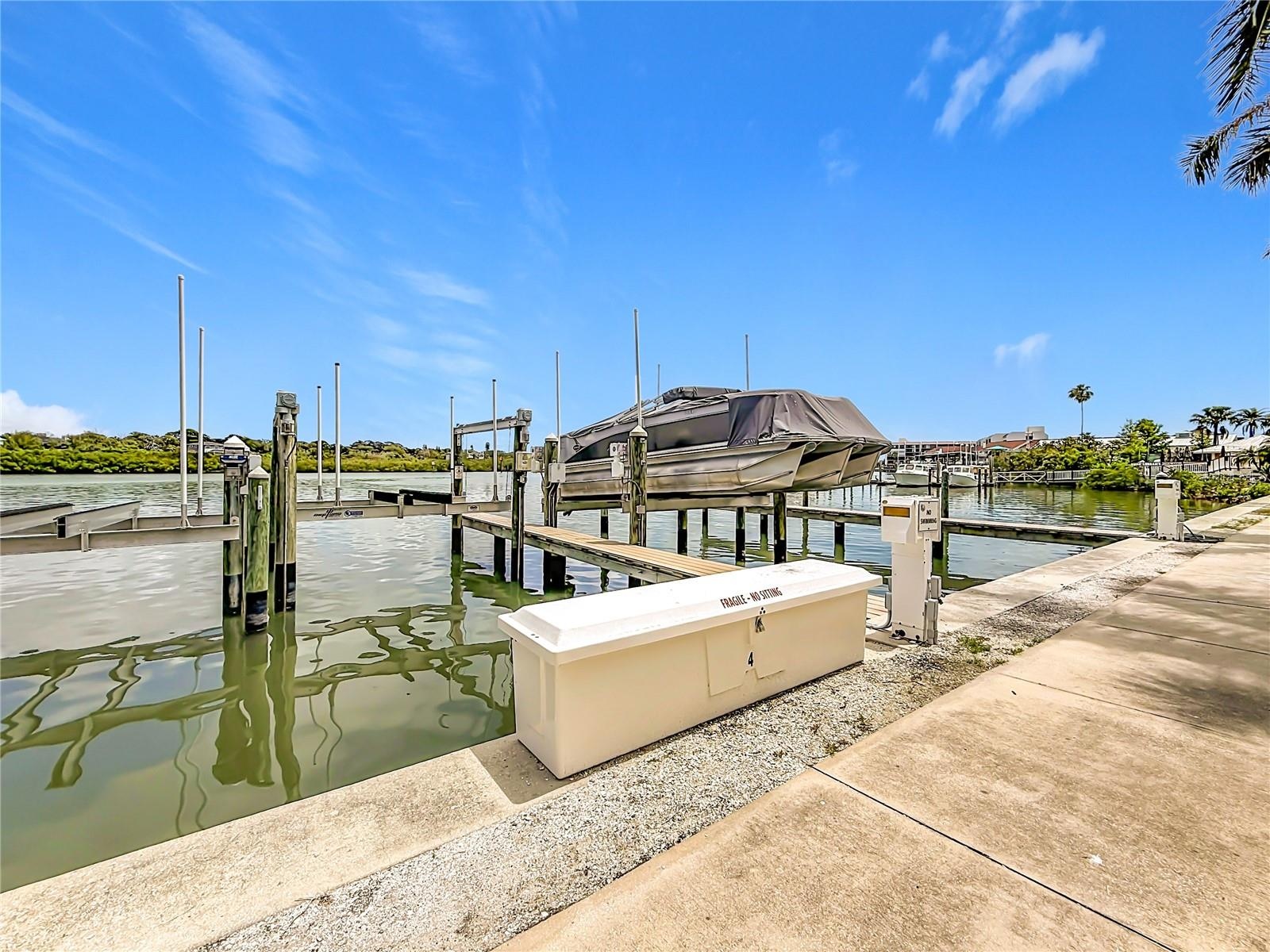 This is your boat slip that conveys with the sale & has a 10,000 lift and a dock box that also conveys.