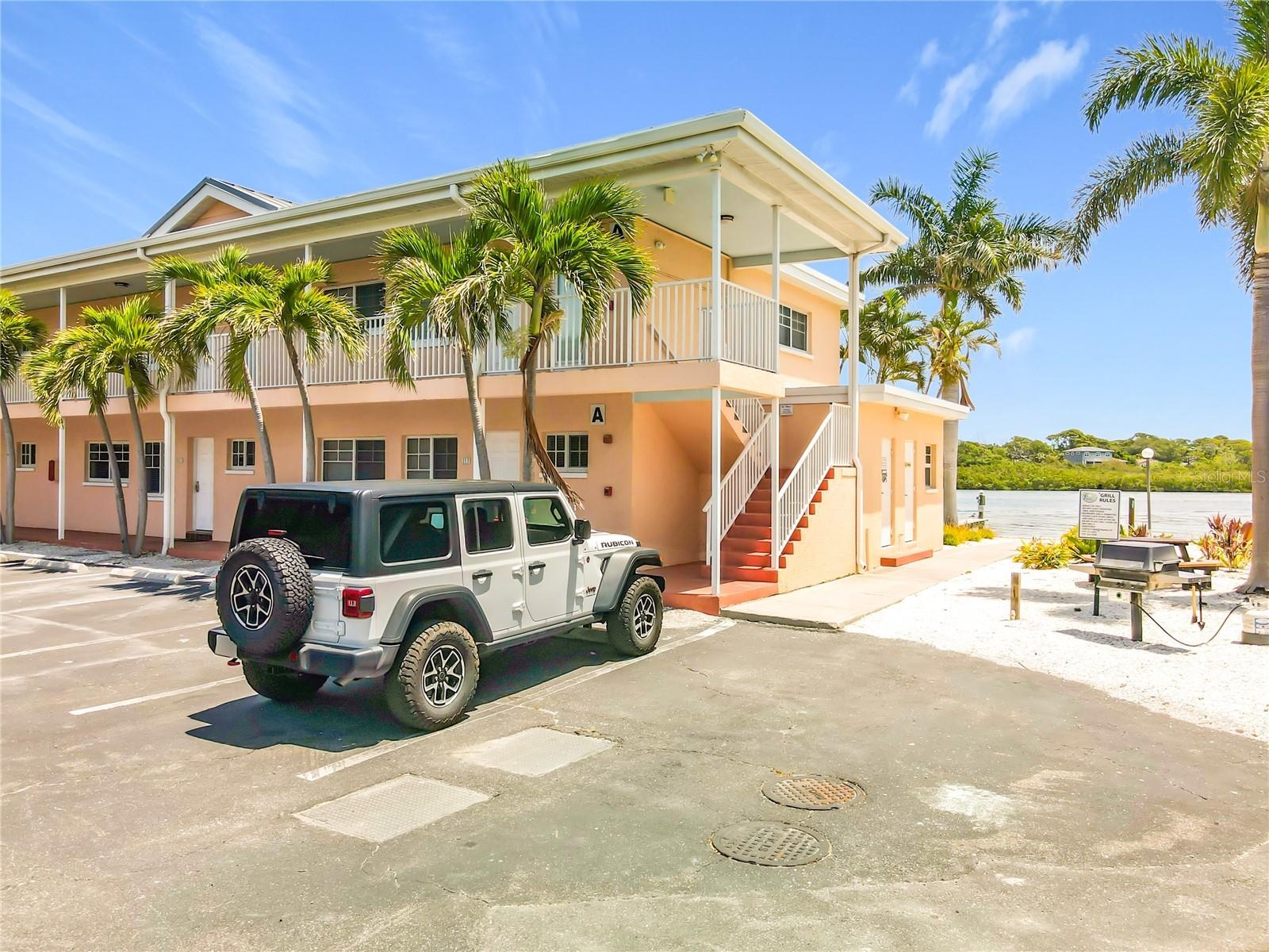 This condo unit is an end unit so you won't have another unit on one side of your unit.  Notice one of Barefoot Beach Resort's picnic area that is loc