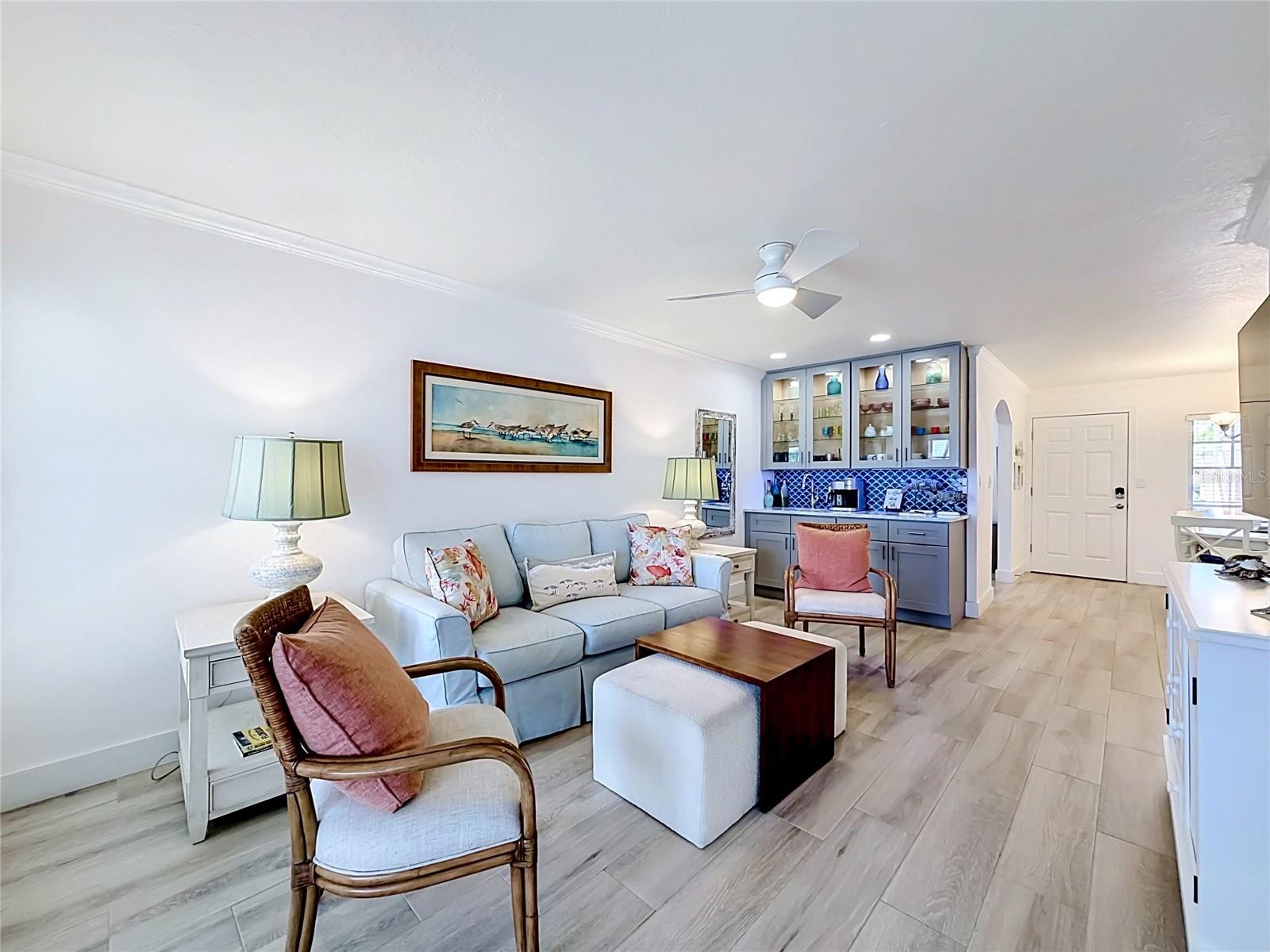 Closer look at the living room area and wet bar.  Notice the tiled flooring thoughout the unit.