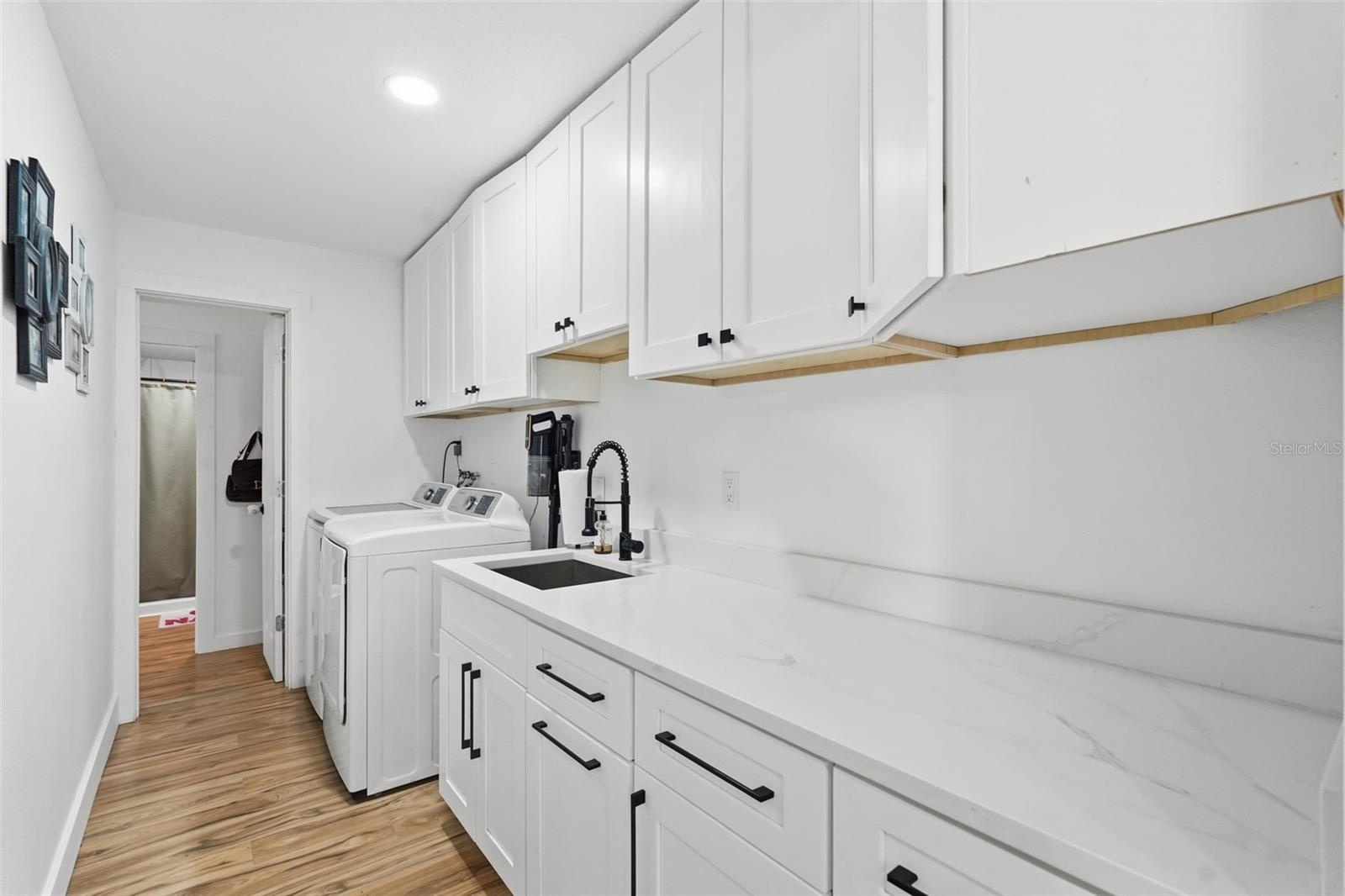 Inside laundry room with great storage