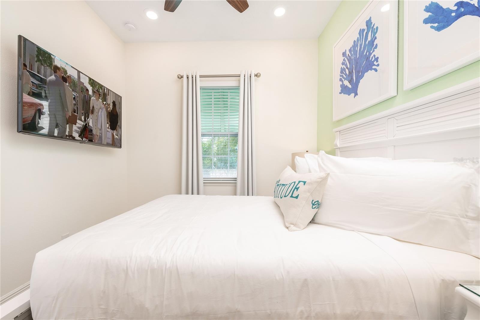 Light and airy bedroom with resort style decor in Margaritaville Orlando investment property