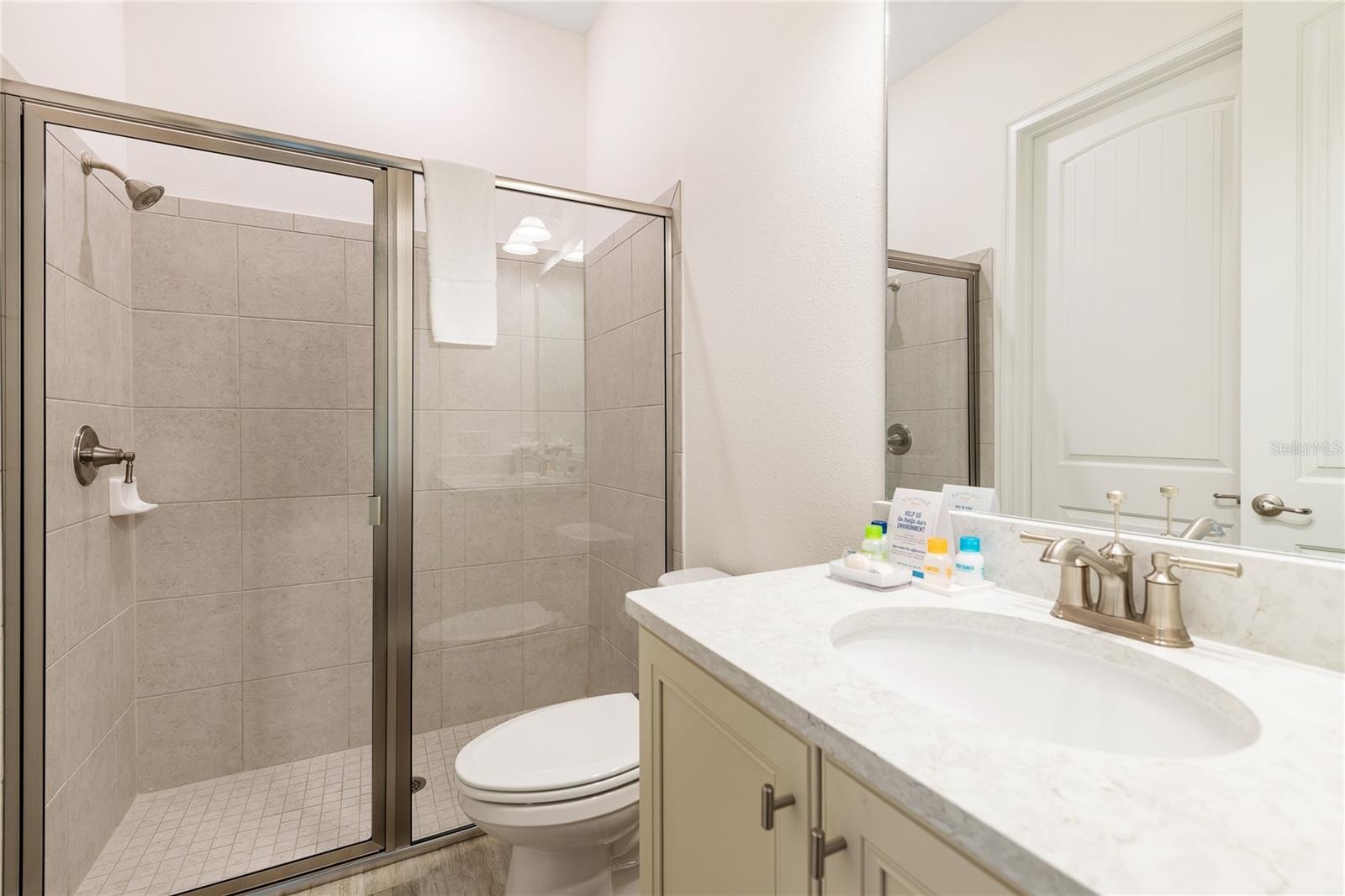 Modern full bathroom with walk in shower and upgraded finishes in Margaritaville Resort Orlando