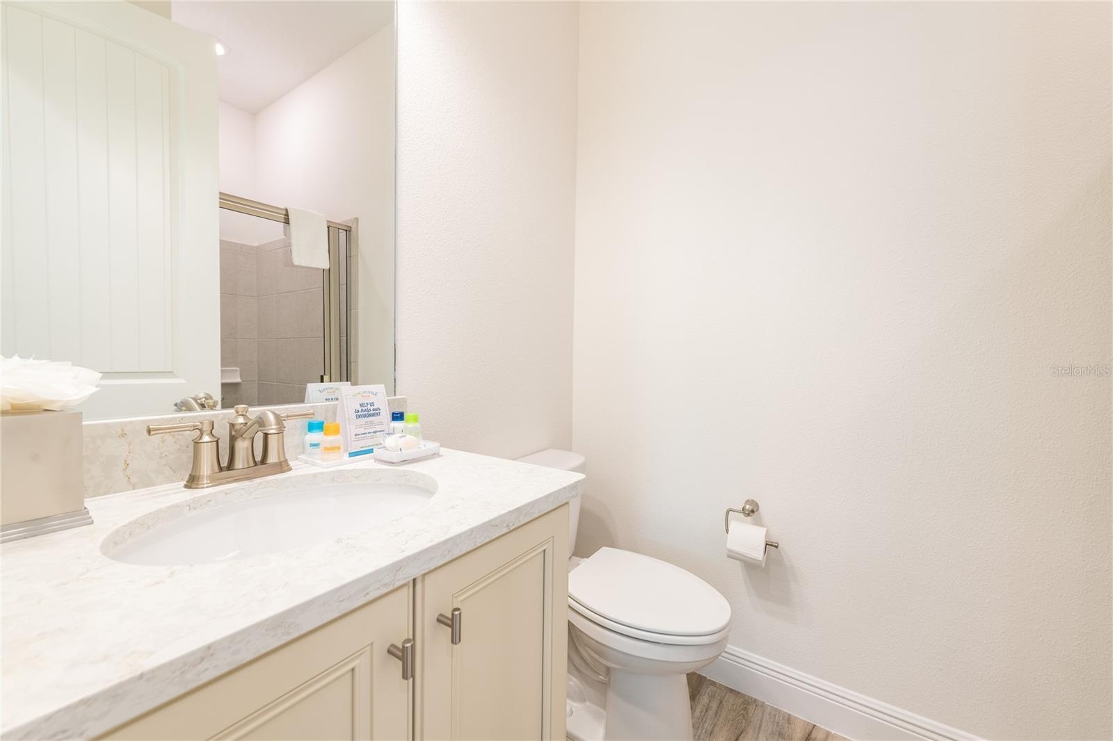Full bathroom with vanity and tub shower combination in Kissimmee Florida vacation home