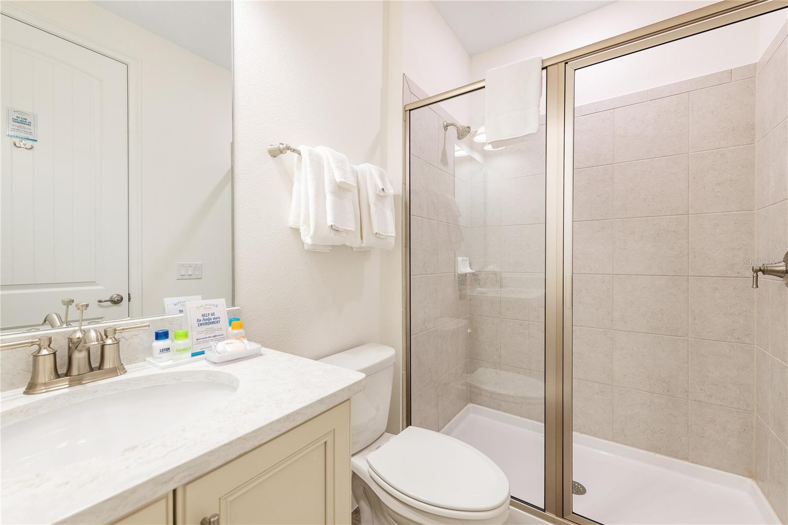 Modern bathroom with walk in shower in Margaritaville Orlando investment property