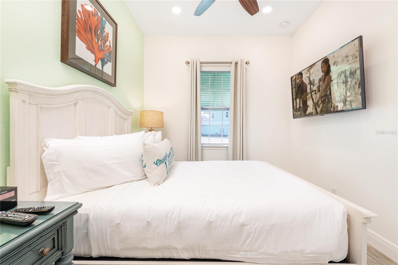 Spacious bedroom with clean coastal design in Kissimmee short term rental approved property