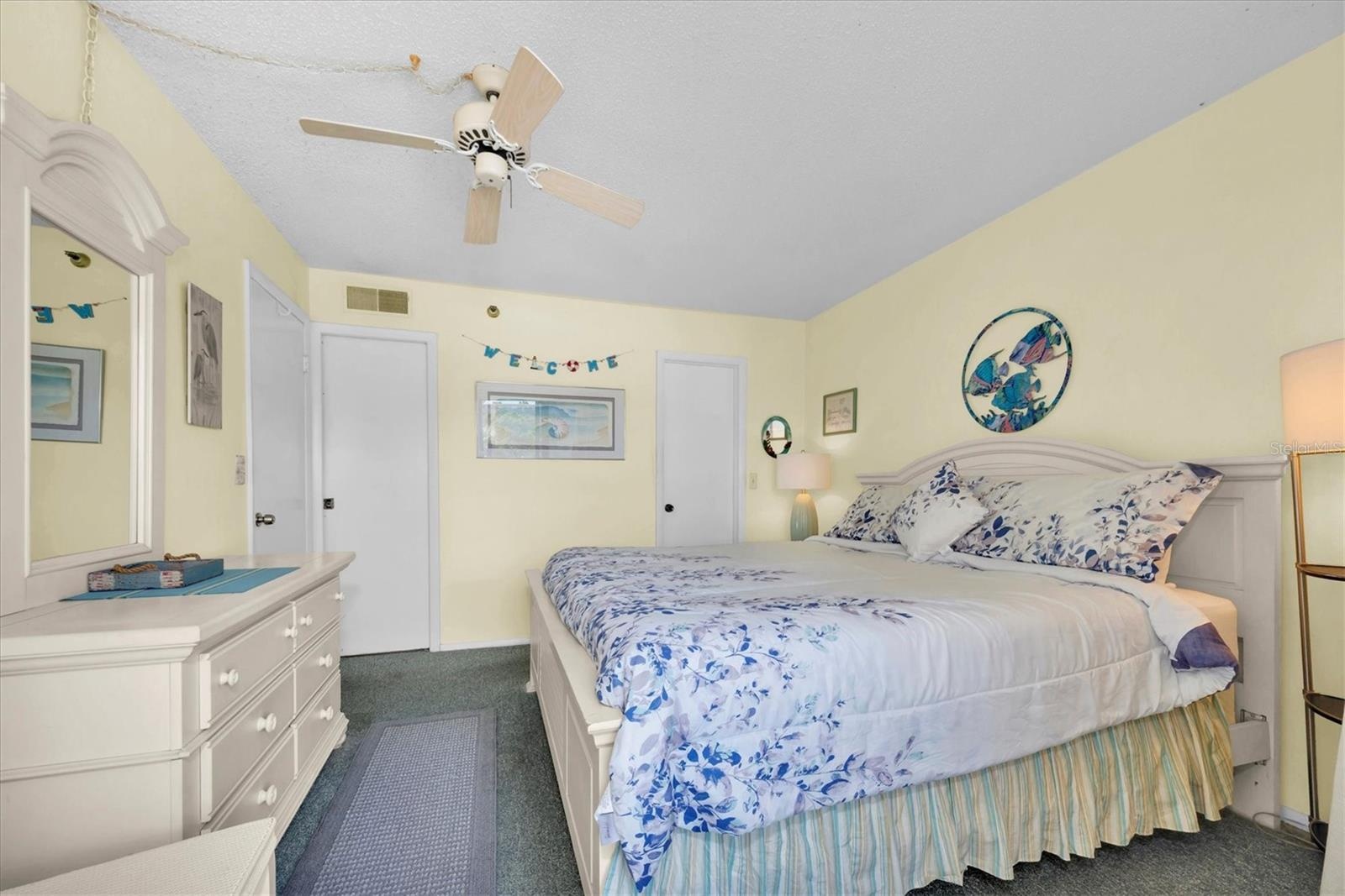 Primary bedroom with balcony access