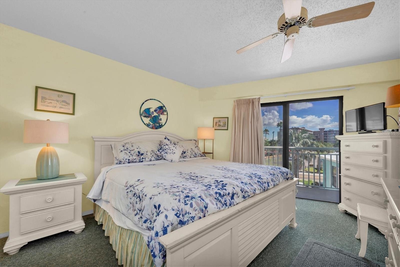 Primary bedroom with balcony access