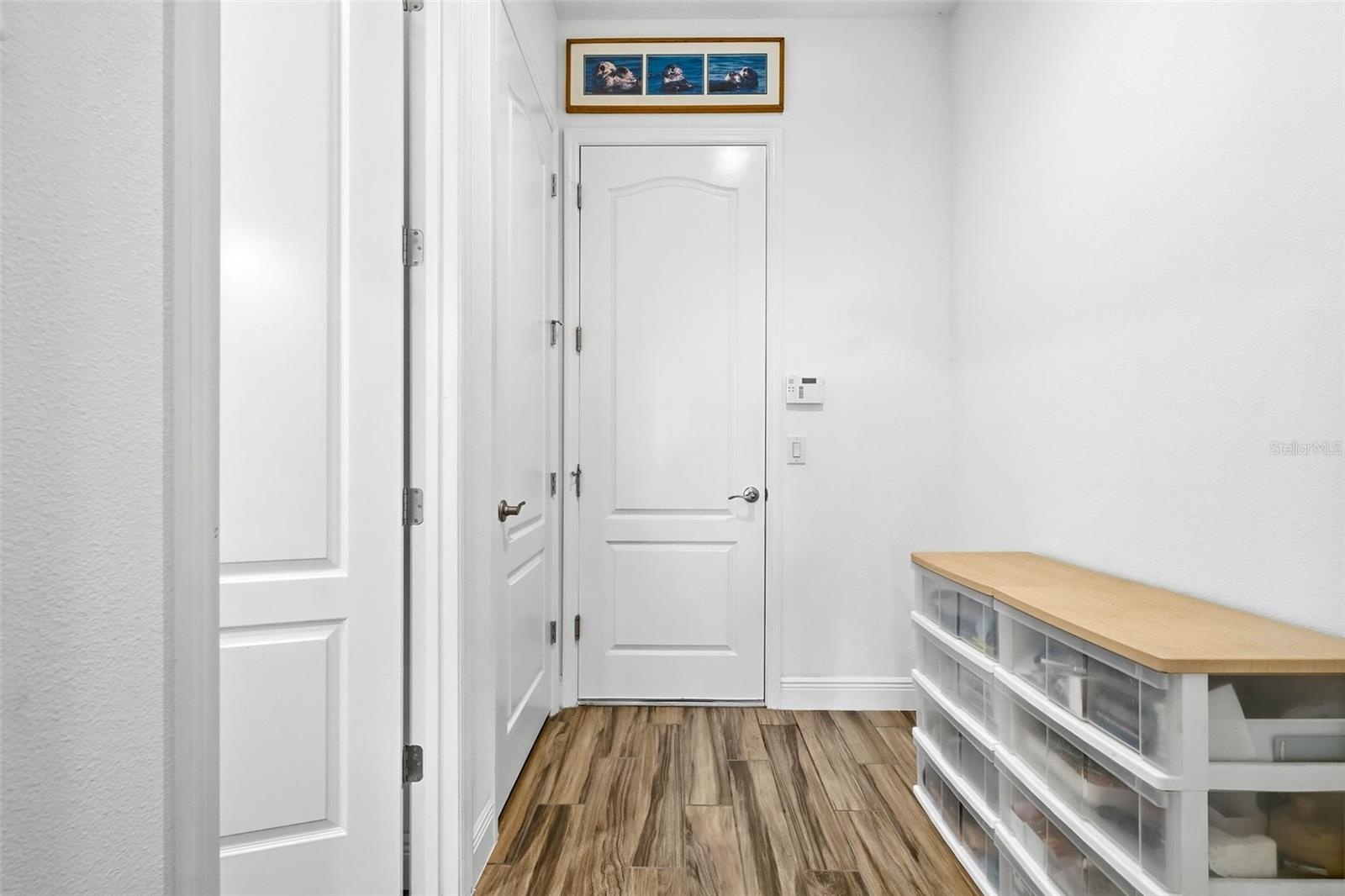 Step in from the garage and find a convenient drop zone—laundry room just to the left for easy access and organization!