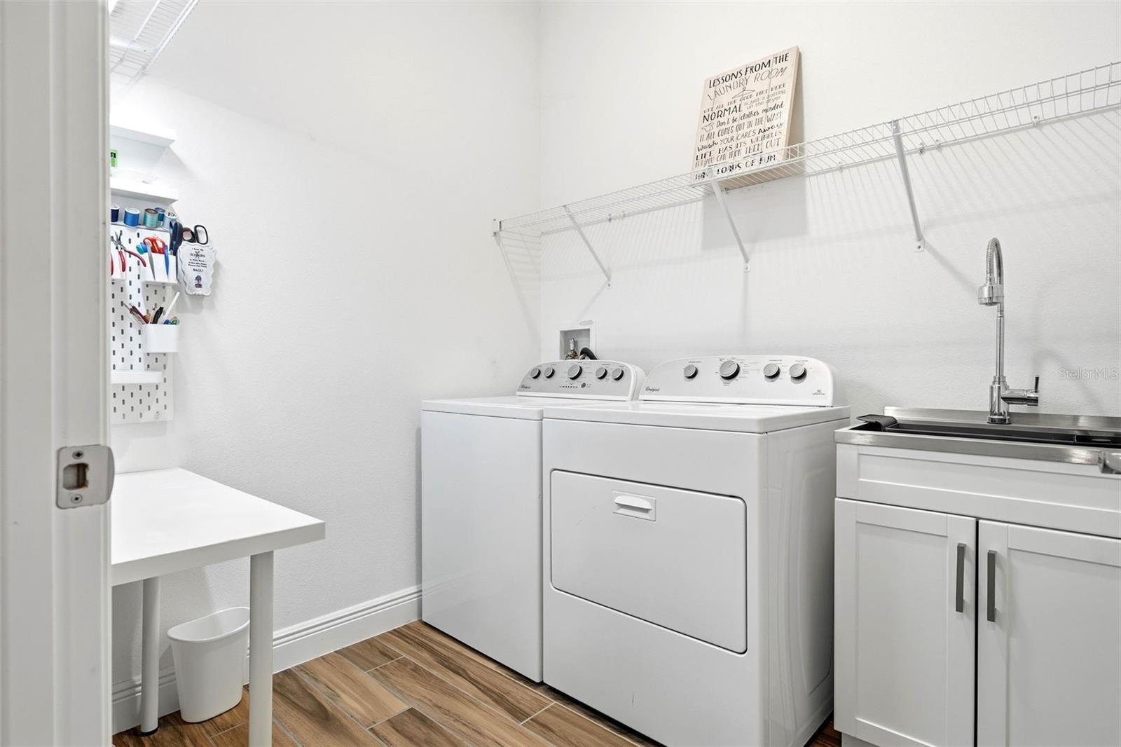 Spacious laundry room with room to sort, fold, and store with ease!
